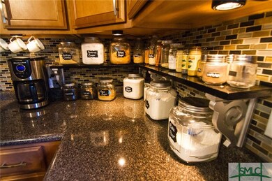 Built in counter top shelving and underneath light