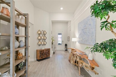 Entrance foyer featuring wood tiled floors and baseboards