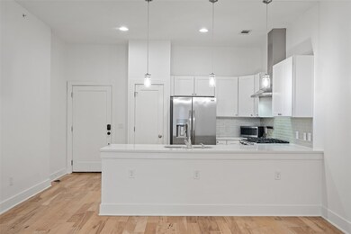 Kitchen featuring appliances with stainless steel