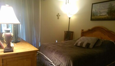 master bedroom w/sliders to the patio