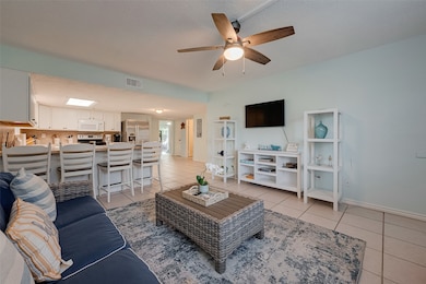 Flowing seamlessly into the open kitchen, the brea