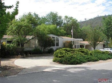 Front of the home with circle drive.  RV parking t