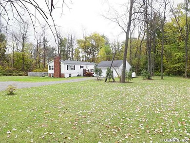 Exterior Front. Large front yard back off the road