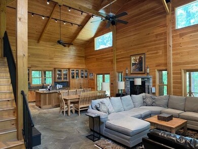 Living room featuring high vaulted ceiling, ceilin