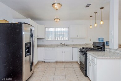 Kitchen is bright and airy with a breakfast bar wi