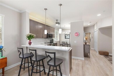 Kitchen featuring crown molding, dark brown cabine