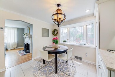 eat in section of kitchen with large bay window pr