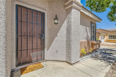 View of exterior entry featuring stucco siding