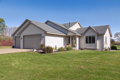 The house is flanked by perennial gardens and prairie views.  And check out that 2022 roof.  Nice touch!