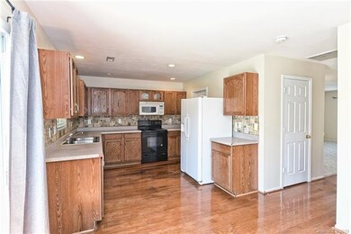 Spacious kitchen with quality wood laminate floors
