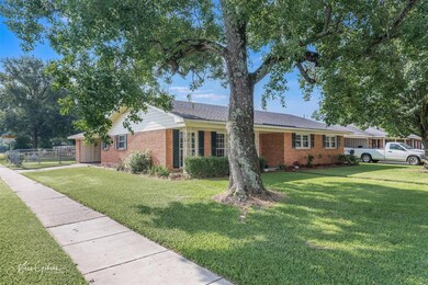 Ranch-style house with a front lawn