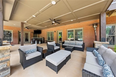 View of patio / terrace with ceiling fan and an outdoor hangout area