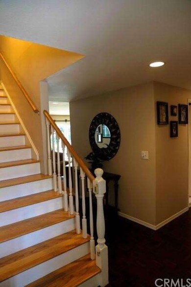 Entry with Dark Hardwood Parquet Flooring and Beau