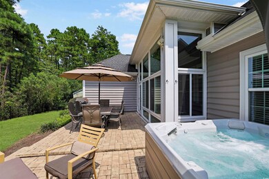 View of patio featuring a hot tub