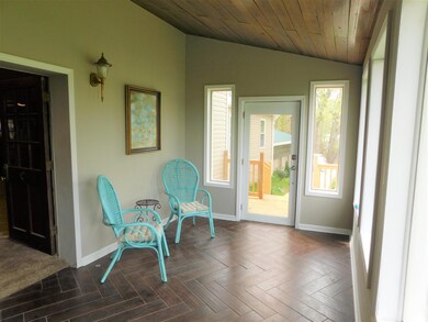 19x9 Foyer showing wood ceiling and tile flooring.