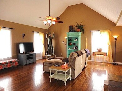 The living room with its 16 foot high vaulted ceilings.  This room has a nice open floor plan with its size of 18x22.
