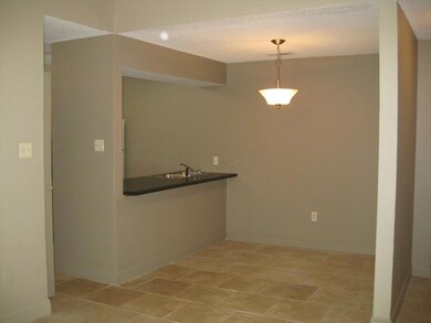 Breakfast bar in dining area with tile floors
