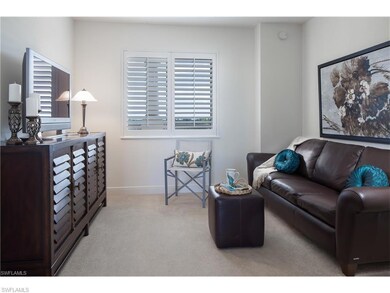 Carpeted living room featuring baseboards and plen