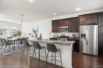 Gourmet Kitchen w/hardwood floors and stainless steel appliances