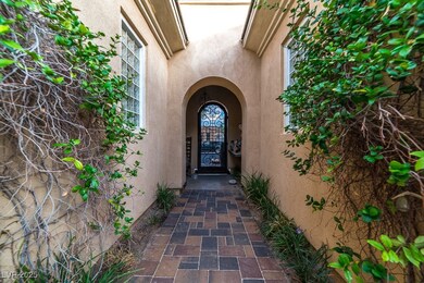 Property entrance featuring stucco siding
