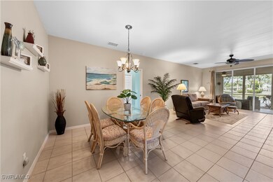 Dining room featuring ceiling fan with notable cha