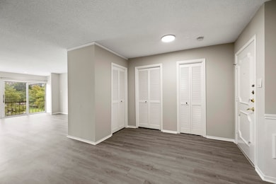Open floor plan with large windows that offers ple