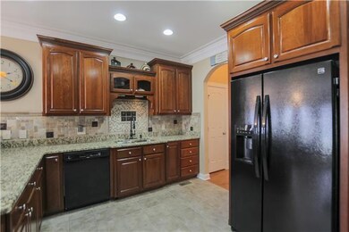 Solid cabinets and great kitchen layout. Open concept! Seller has also added a water softening system.