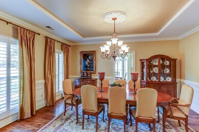 This formal entertaining space features a decorati