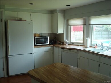Kitchen offers abundant counter space and cabinets