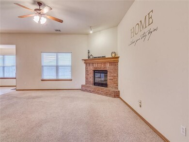 Large open living area with Brick fireplace that h