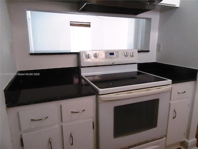 Kitchen with passthroug window allows lots of natural light.