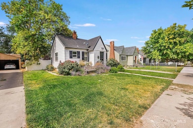 View of front of property with a chimney