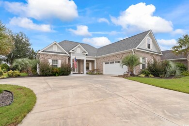 View of front of house with a garage and a front y