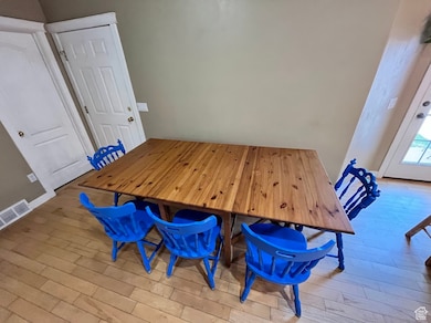 Dining area featuring wood finished floors