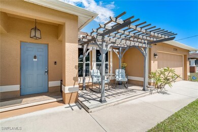 View of exterior entry featuring stucco siding, a