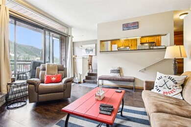 Living room featuring a mountain view and wood fin