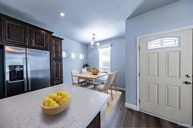This photo features a virtual staging effect. The property is vacant.