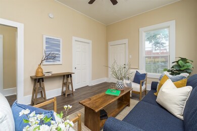 Another view of living room, door to hall and door