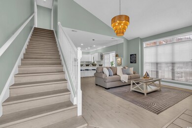 Stairway featuring visible vents, recessed lightin