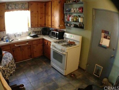 Kitchen has tile floors, tile counters and the ori