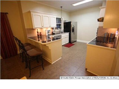 Kitchen has new floors, granite counters and tile 