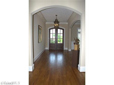 Entry. Please note the size of this elegant foyer complete with 10  Ceilings and double arches leading into dining room and great room.