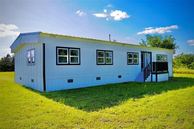 Rear view of property with crawl space and a yard