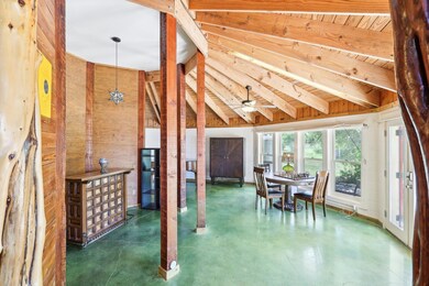 Dining area with finished concrete flooring, a ce