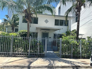 View of front facade featuring stucco siding, a fe