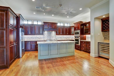 KITCHEN - Efficient style island kitchen with storage galore!  Built-in stainless steel front appliances including wine storage.