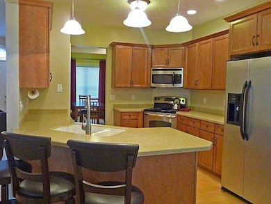 Kitchen. Breakfast bar-corian counter tops.