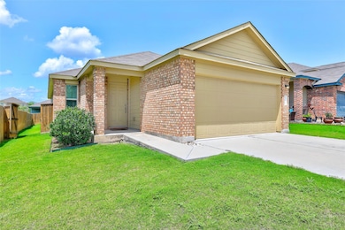 Single story home with brick siding, a garage, dr