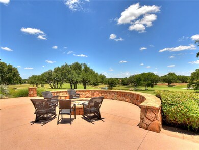 View of patio / terrace featuring an outdoor fire