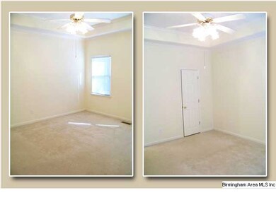 Master bedroom has lots of natural light, neutral 
